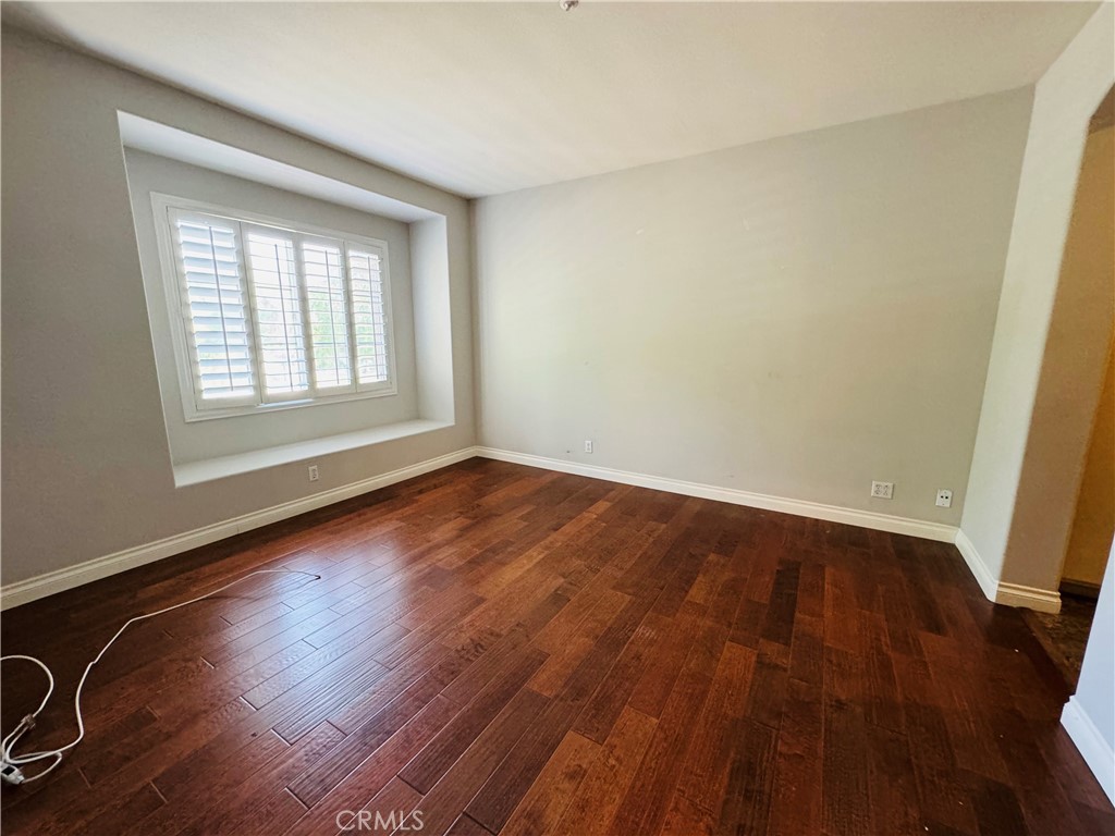 3 Bradford Irvine, CA 92602 - Photo 15 of 21 an empty room with wooden floor and windows