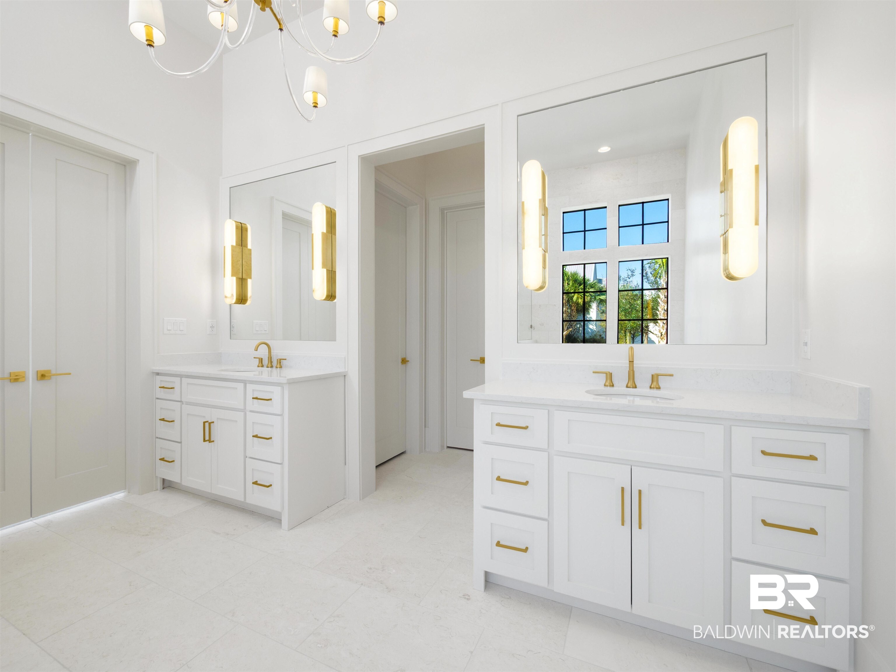 31292 River Road Orange Beach, AL 36561 - Photo 23 of 48 Full bathroom featuring two vanities, a sink, and a notable chandelier