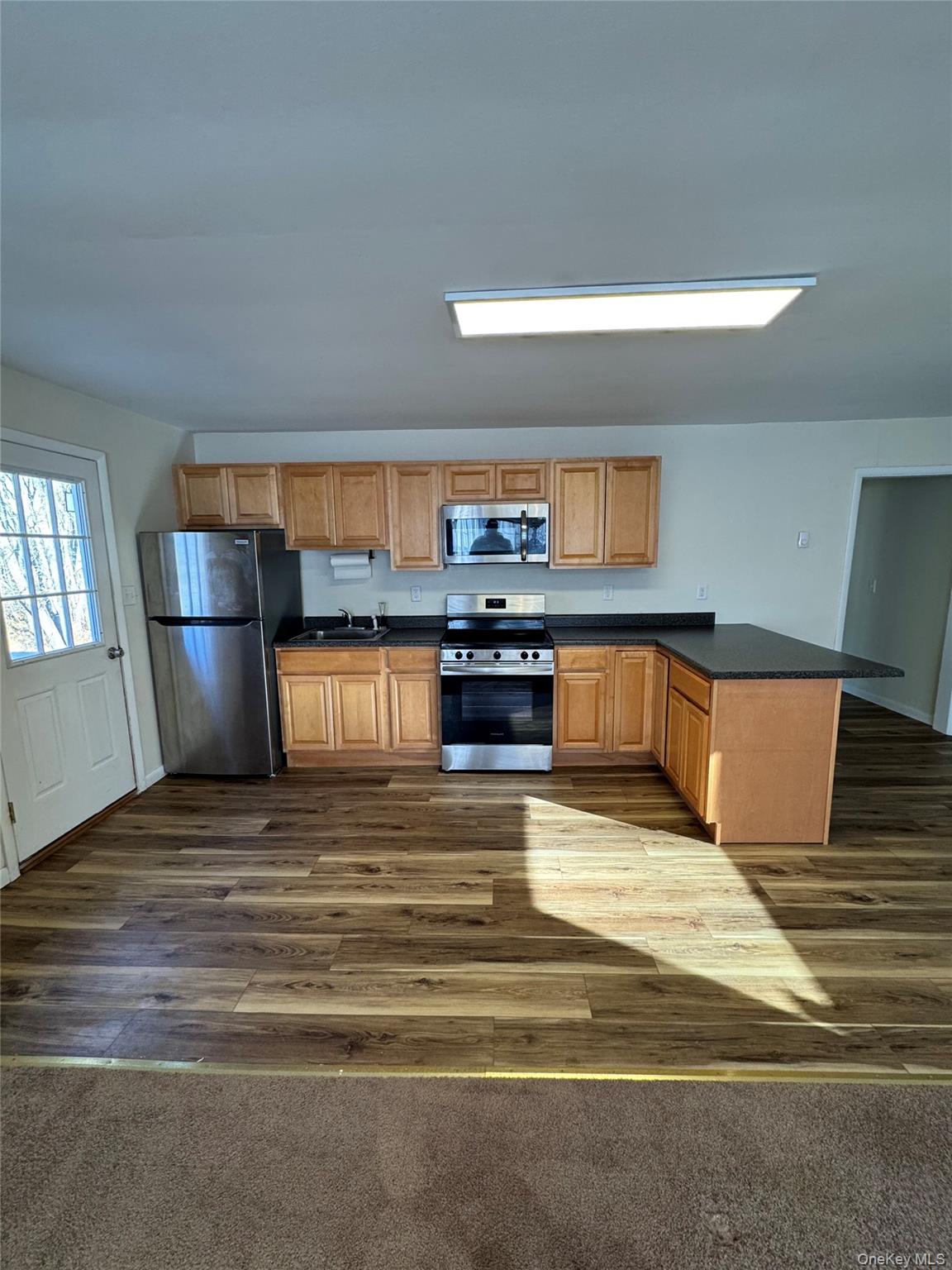 a view of kitchen and kitchen with furniture