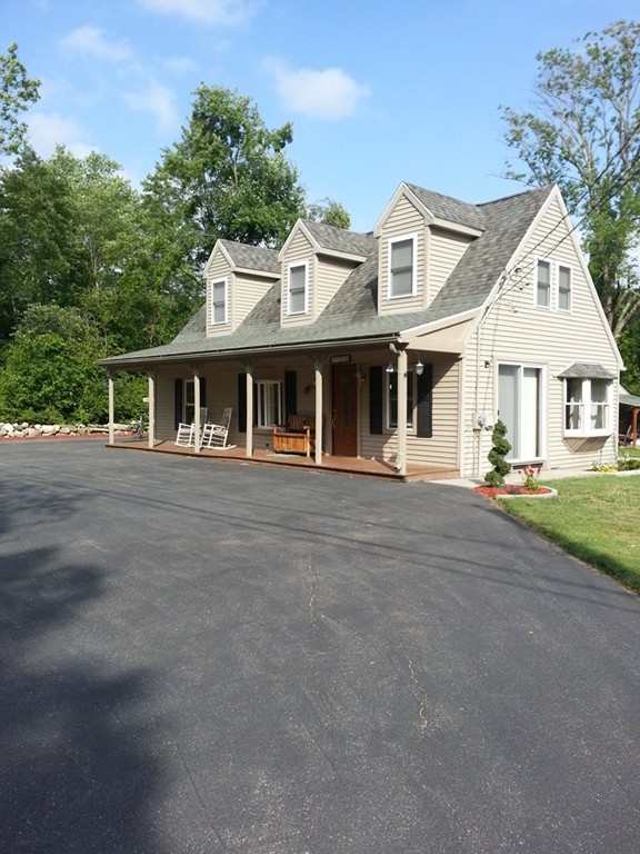 7 Doane Road Ware, MA 01082 - Photo 1 of 19 a front view of a house with a yard