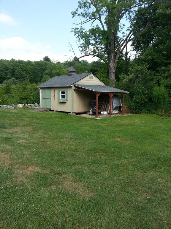 7 Doane Road Ware, MA 01082 - Photo 18 of 19 a front view of a house with garden