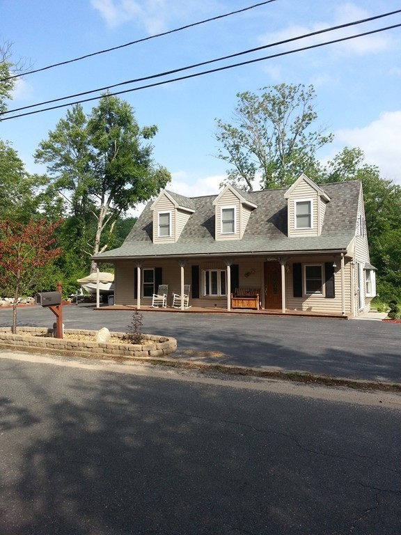 7 Doane Road Ware, MA 01082 - Photo 2 of 19 a front view of a house with a garden