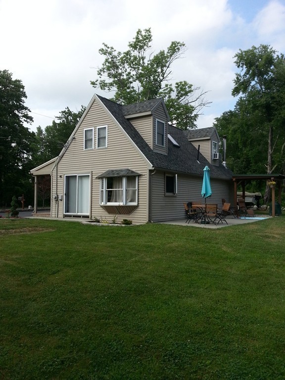 7 Doane Road Ware, MA 01082 - Photo 4 of 19 a front view of house with yard and green space