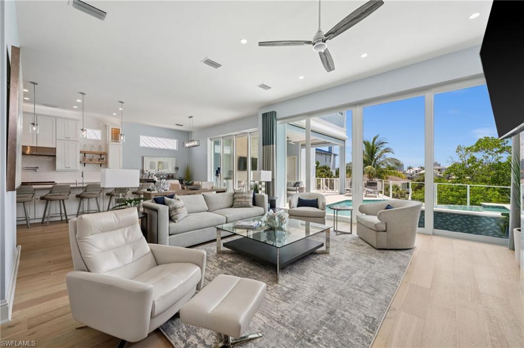 26659 Hickory Boulevard Bonita Springs, FL 34134 - Photo 15 of 46 a living room with furniture and a large window