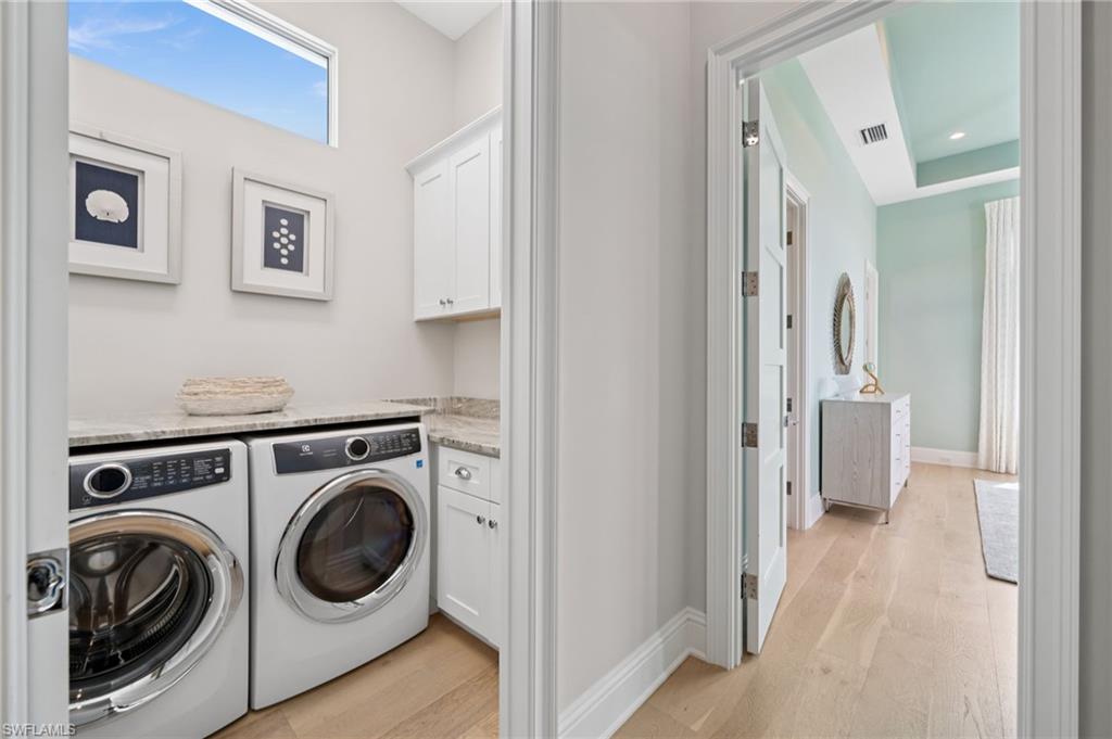 26659 Hickory Boulevard Bonita Springs, FL 34134 - Photo 24 of 46 a view of a hallway with washer and dryer