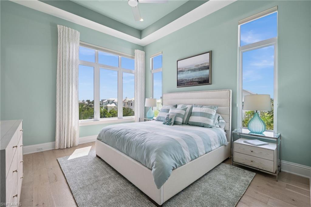 26659 Hickory Boulevard Bonita Springs, FL 34134 - Photo 28 of 46 a bedroom with a bed and a painting on the wall