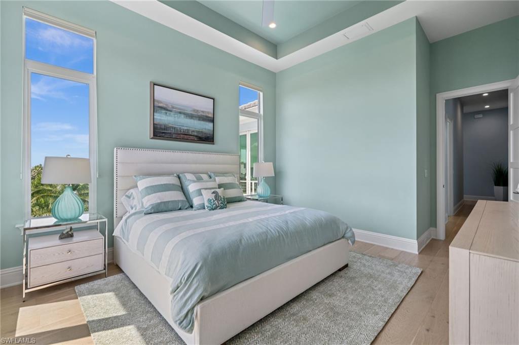 26659 Hickory Boulevard Bonita Springs, FL 34134 - Photo 29 of 46 a bedroom with a bed and painting on the wall