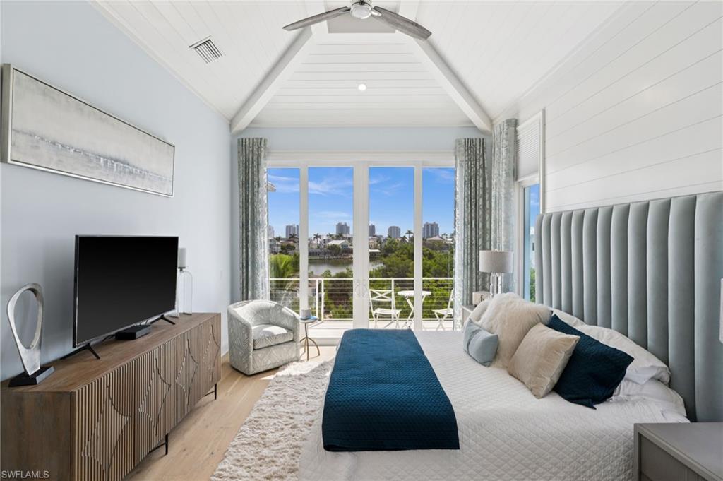 26659 Hickory Boulevard Bonita Springs, FL 34134 - Photo 31 of 46 a living room with furniture and a flat screen tv