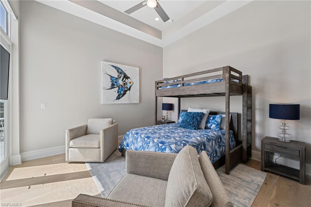 26659 Hickory Boulevard Bonita Springs, FL 34134 - Photo 35 of 46 a bedroom with a bed and a couch