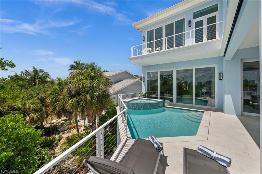 26659 Hickory Boulevard Bonita Springs, FL 34134 - Photo 4 of 46 a view of a house with a backyard