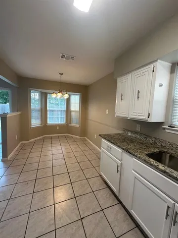 a view of a kitchen with white appliances
