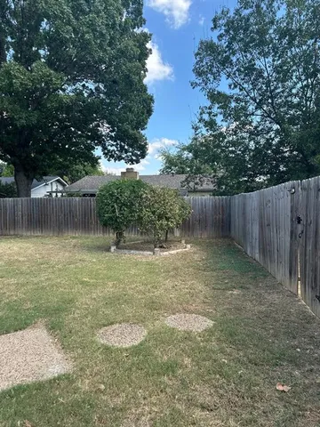 a backyard of a house with lots of green space
