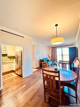 a dining room with furniture and window