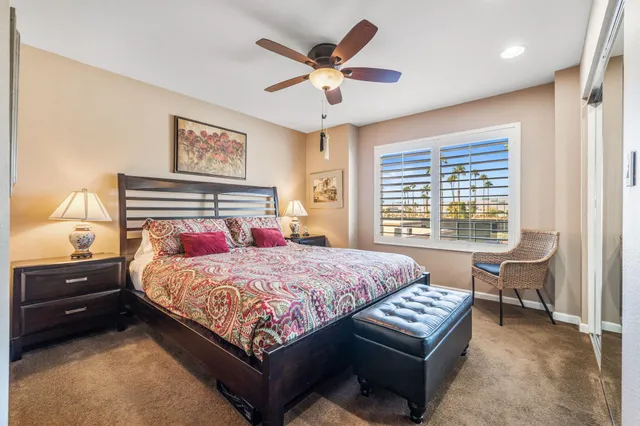 a bedroom with a bed and a couch