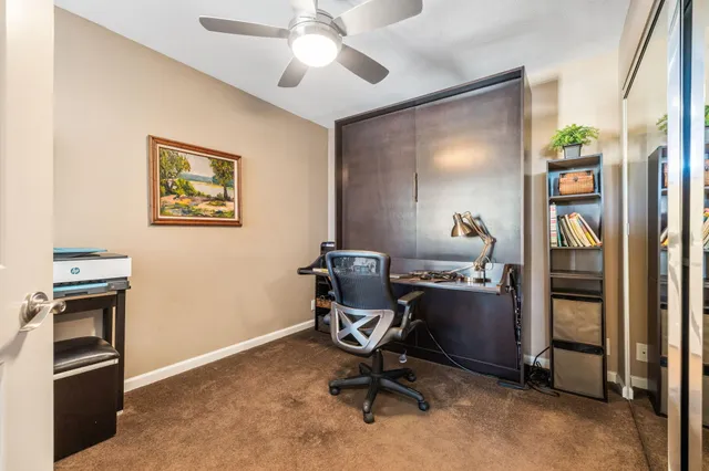 a view of a workspace with furniture