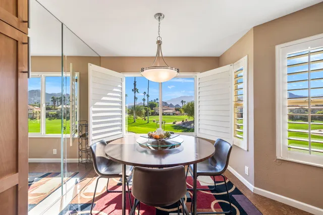 a view of a dining room with furniture window and outside view