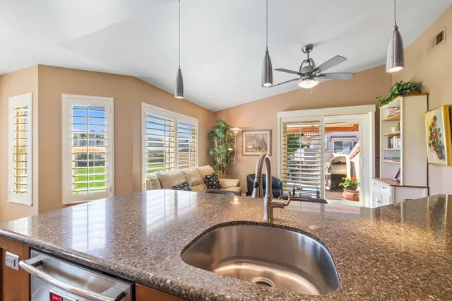 a view of a living room and kitchen