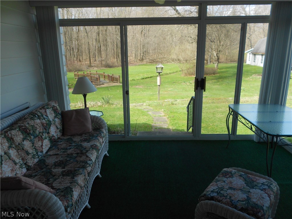 990 South Hametown Road Akron, OH 44321 - Photo 18 of 22 Bright sunroom with view of creek & woods
