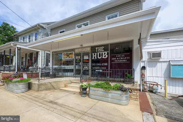 a view of a building with sitting area