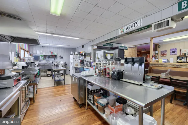 a bathroom with a sink mirror and toilet