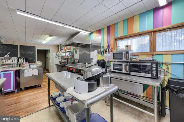 a workspace with furniture and wooden floor