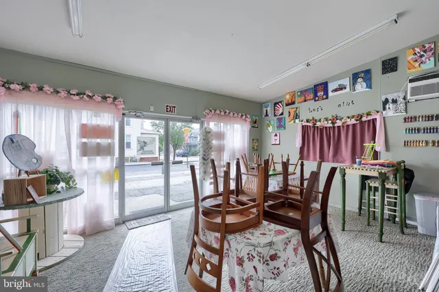 a living room with lots of furniture and a wooden floor