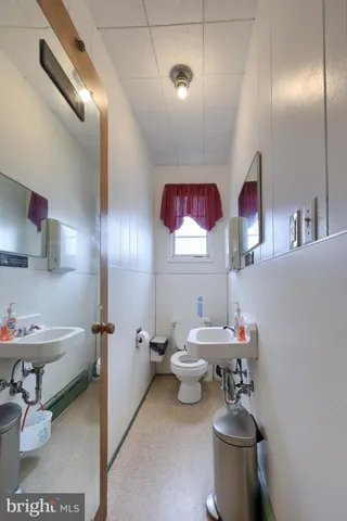 a living room with lots of furniture and kitchen view