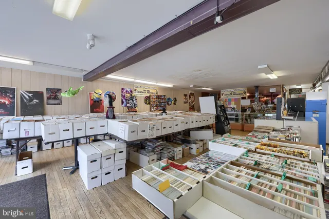 a room with lots of furniture and a rug