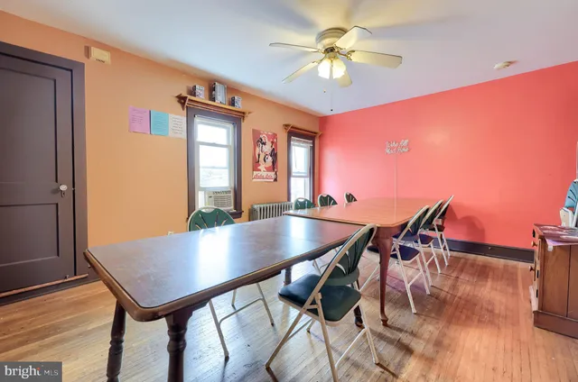 a kitchen with stainless steel appliances a sink a stove and window
