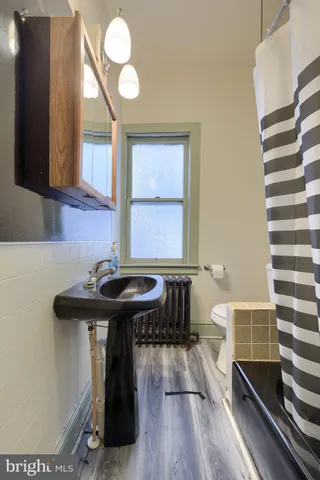 a bed room with a bed and a window