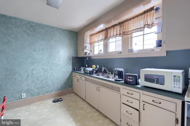 an aerial view of a house with swimming pool and patio