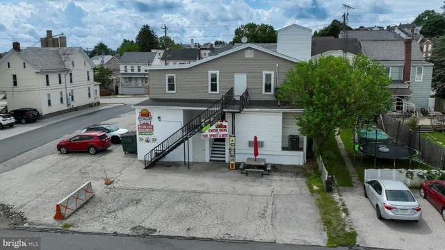 a view of a building with sitting area
