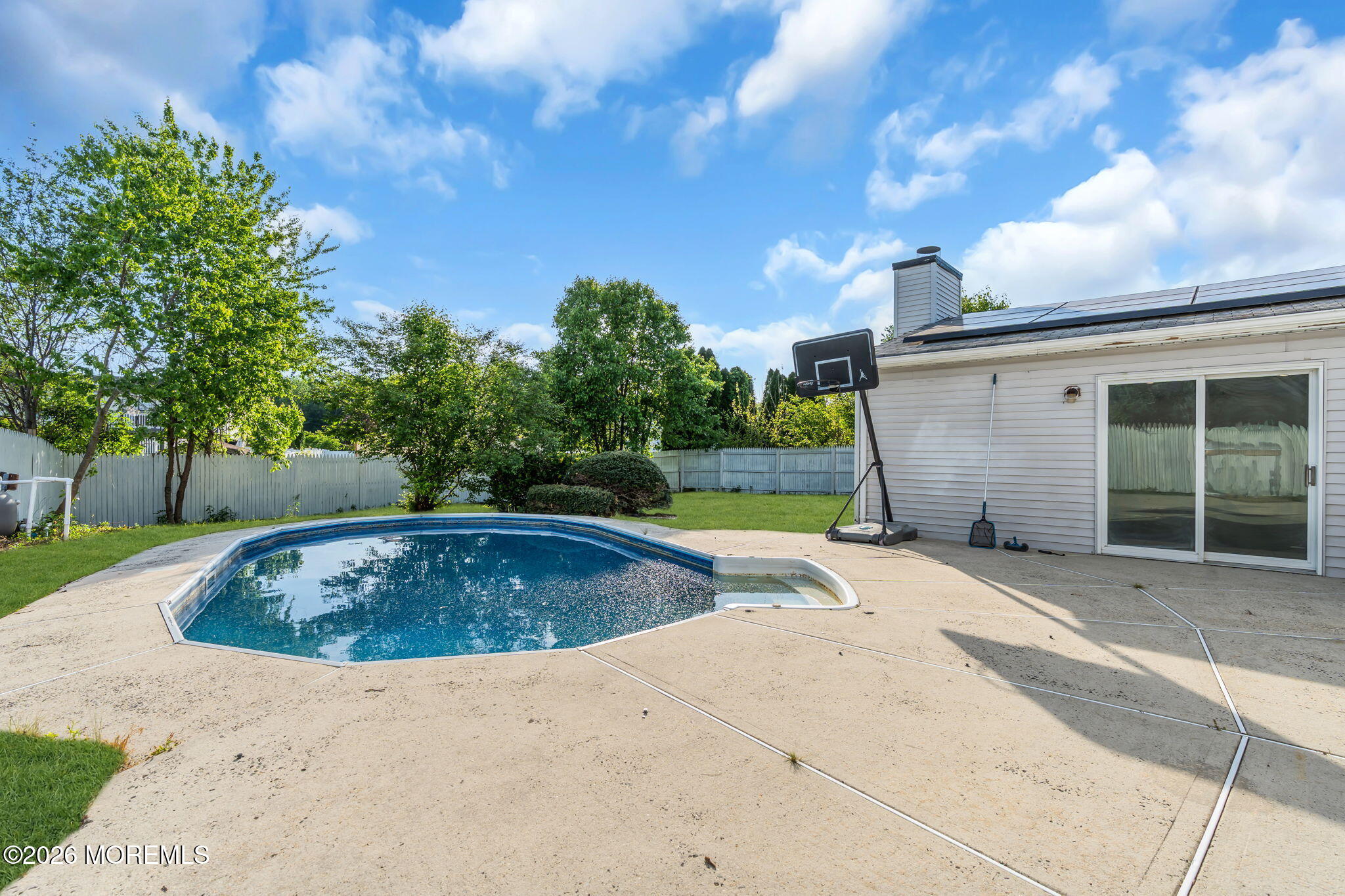 45 Peachstone Road Howell, NJ 07731 - Photo 48 of 54 a view of swimming pool with a yard and large tree