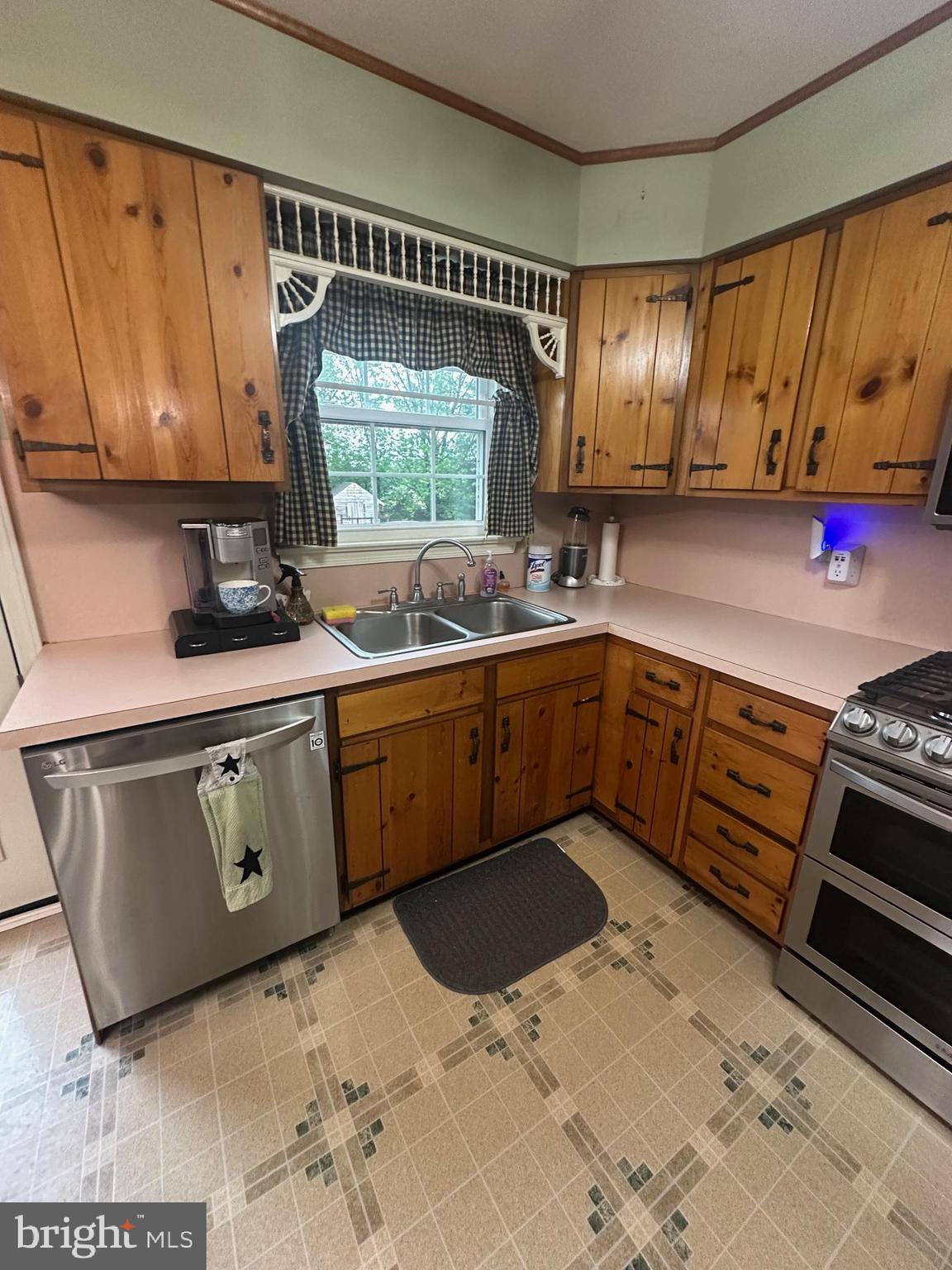 101 Michael Street Buena, NJ 08310 - Photo 6 of 28 a kitchen with stainless steel appliances granite countertop a sink stove and cabinets