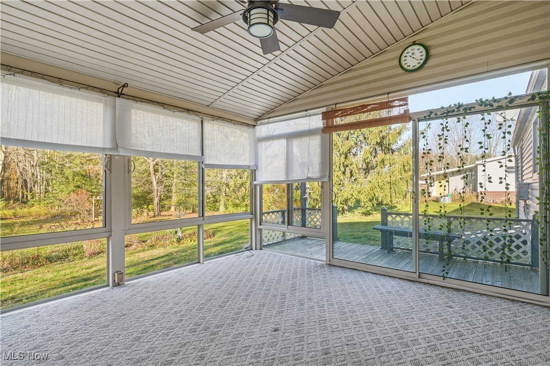 3275 Ranfield Road Kent, OH 44240 - Photo 29 of 33 Unfurnished sunroom with a ceiling fan and vaulted ceiling
