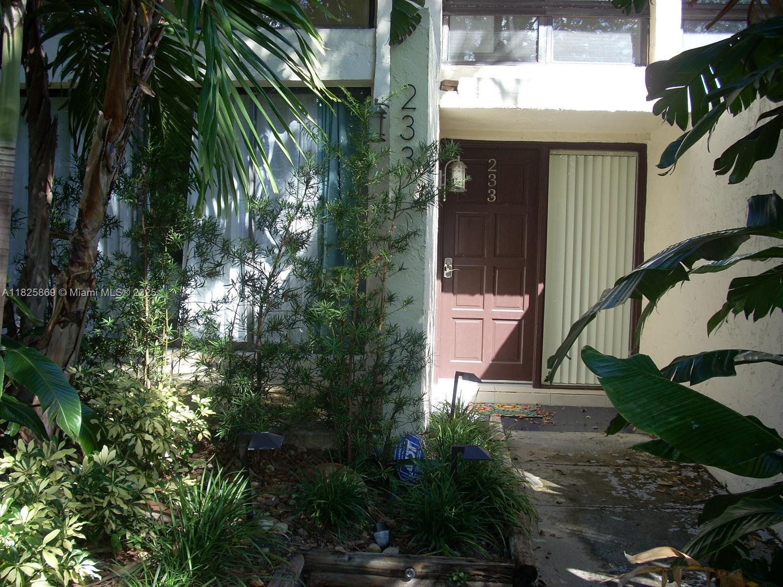 Ojus Miami, FL 33180 - Photo 1 of 15 a front view of a house with a yard
