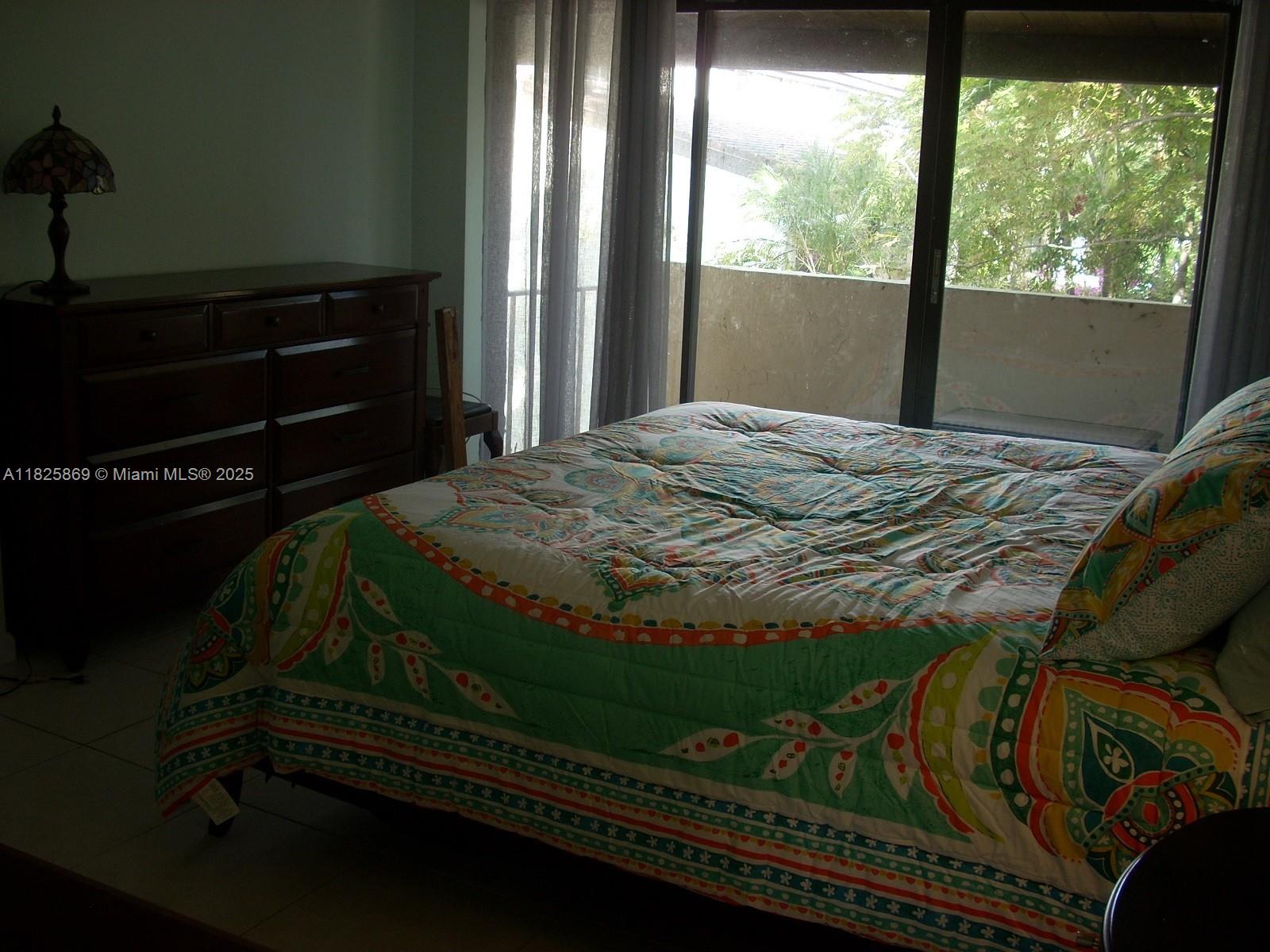 Ojus Miami, FL 33180 - Photo 11 of 15 a bed sitting in a bedroom next to a window