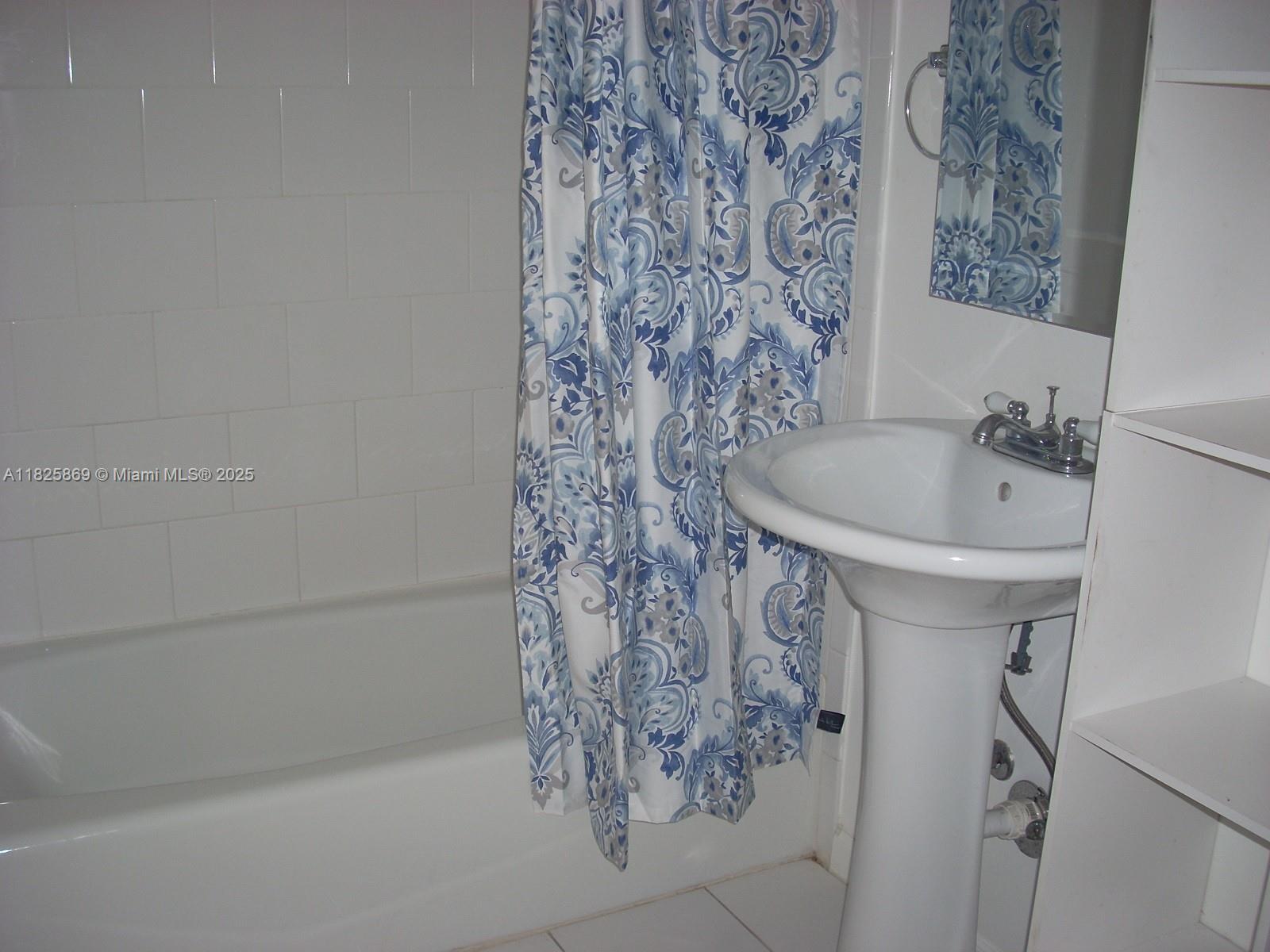 Ojus Miami, FL 33180 - Photo 15 of 15 a bathroom with a bathtub and shower