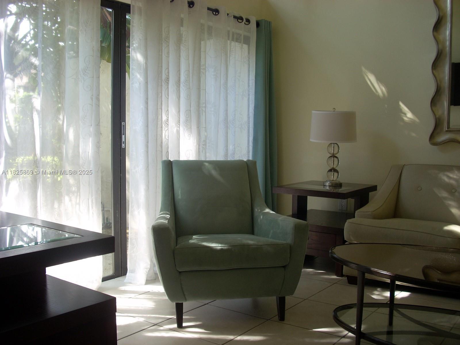 Ojus Miami, FL 33180 - Photo 2 of 15 a living room with furniture and a window