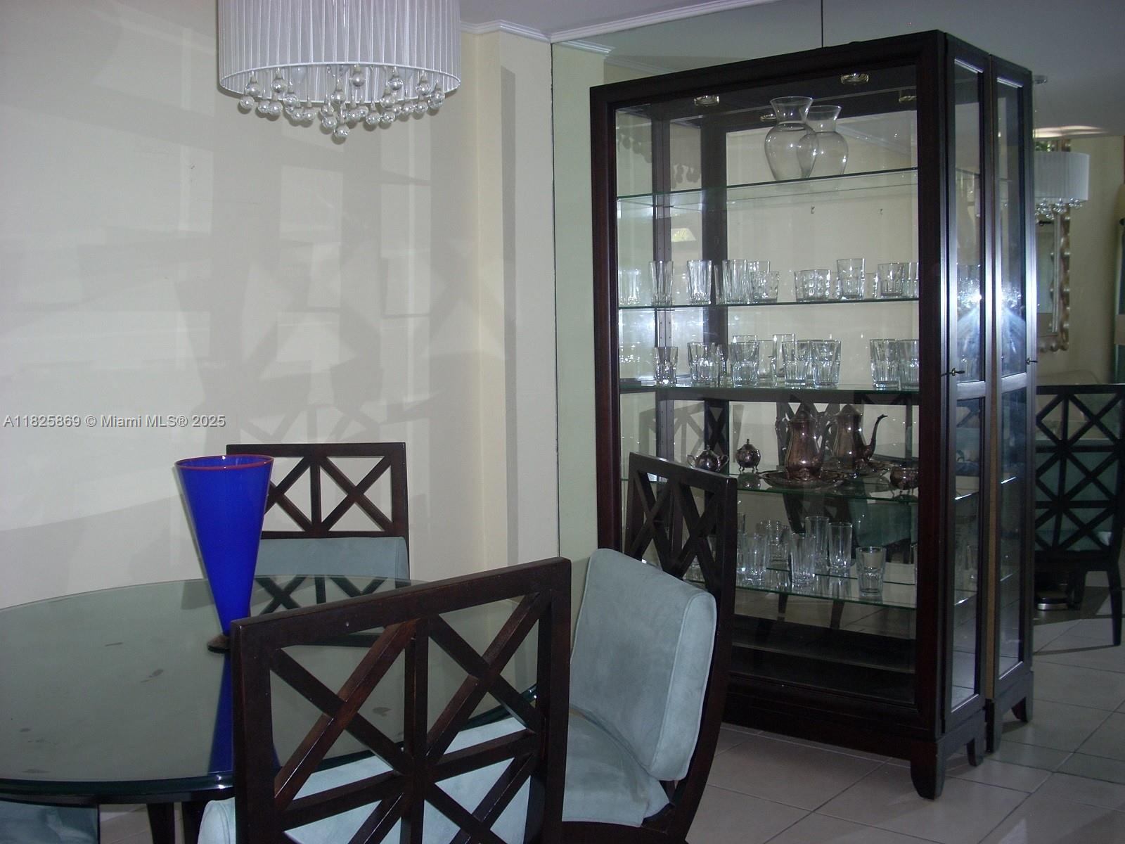 Ojus Miami, FL 33180 - Photo 5 of 15 a dining room with furniture and window