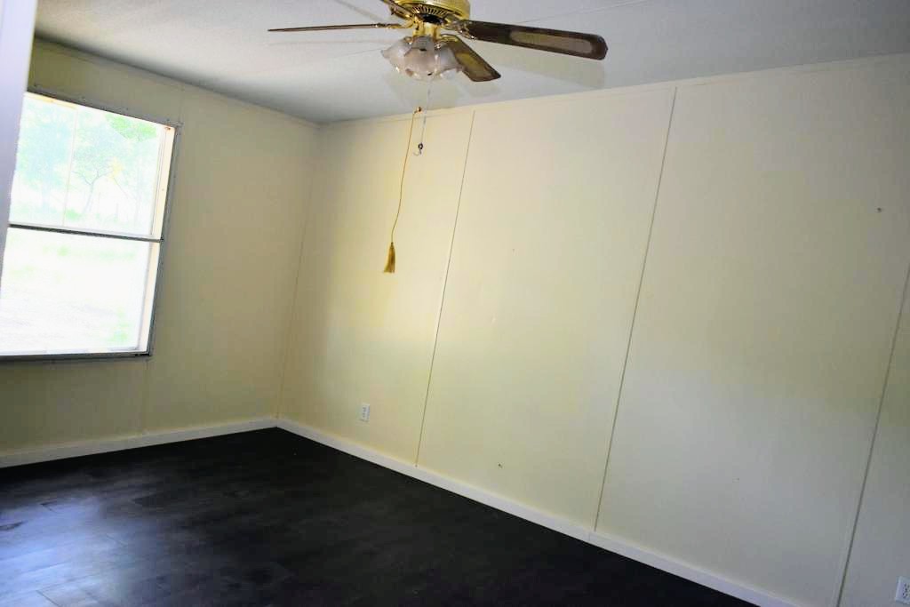 8607 Burleson Manor Road, Unit A Manor, TX 78653 - Photo 6 of 11 a view of a small space with wooden floor and a window