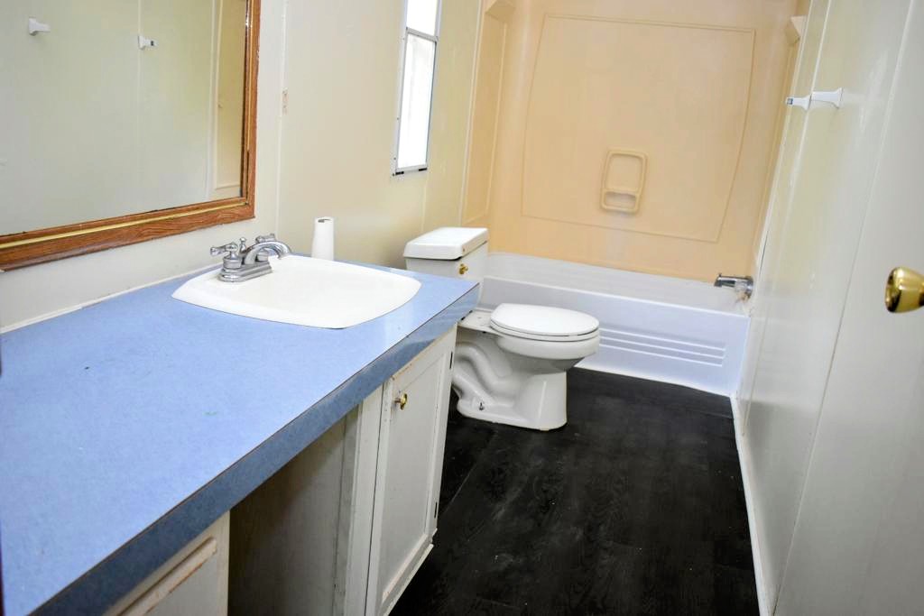 8607 Burleson Manor Road, Unit A Manor, TX 78653 - Photo 9 of 11 a bathroom with a sink a toilet and shower