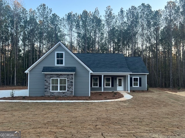 179 McLean Road, Unit TRACT 5B Milner, GA 30257 - Photo 1 of 1 a front view of a house with a garden