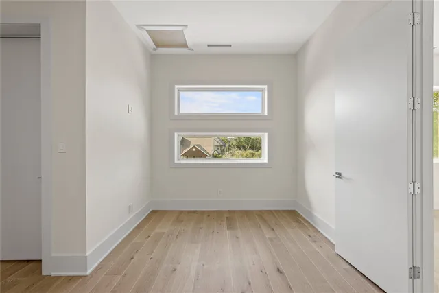 a bathroom with a double vanity sink mirror and toilet