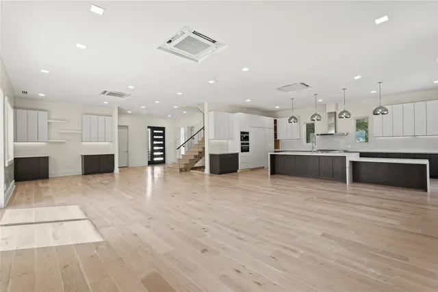 an aerial view of a house with a yard and trees