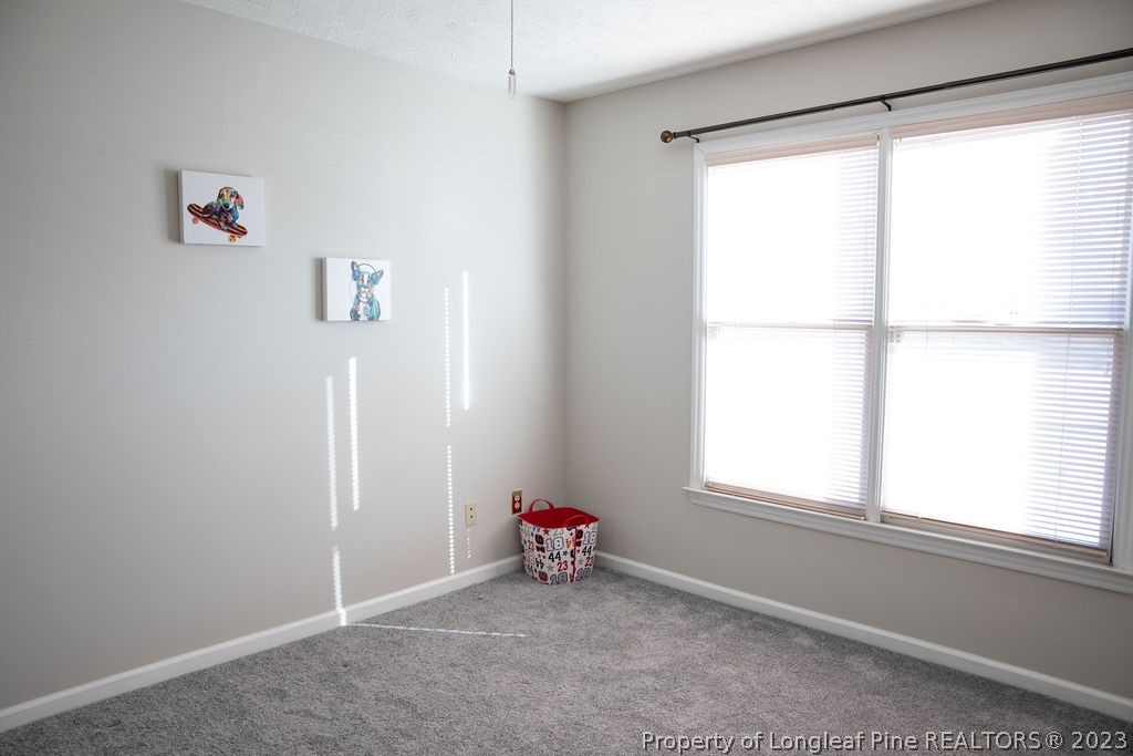 5804 Bibar Road Fayetteville, NC 28304 - Photo 22 of 37 a view of an empty room with a window
