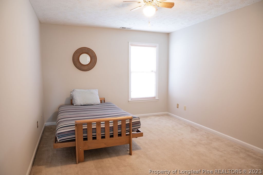 5804 Bibar Road Fayetteville, NC 28304 - Photo 28 of 37 a bedroom with a bed and a window