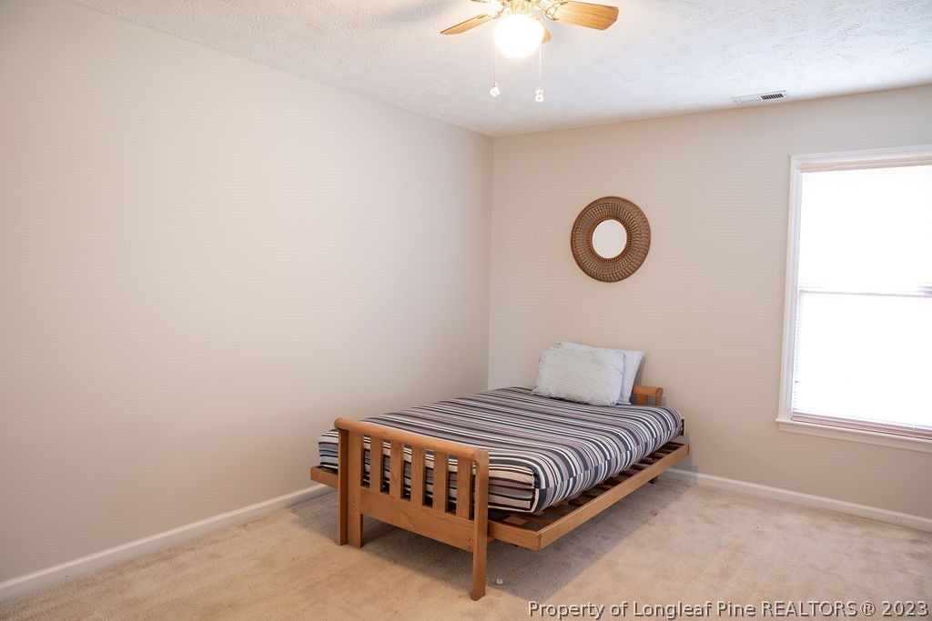 5804 Bibar Road Fayetteville, NC 28304 - Photo 29 of 37 a bedroom with a bed and a window