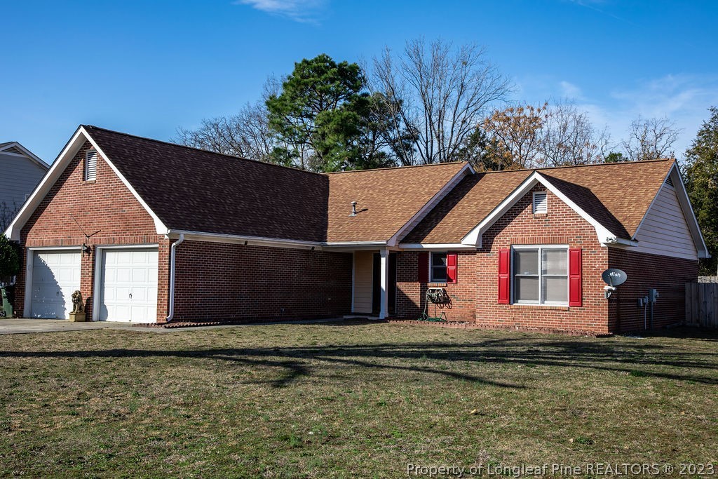 5804 Bibar Road Fayetteville, NC 28304 - Photo 3 of 37 a front view of a house with a yard