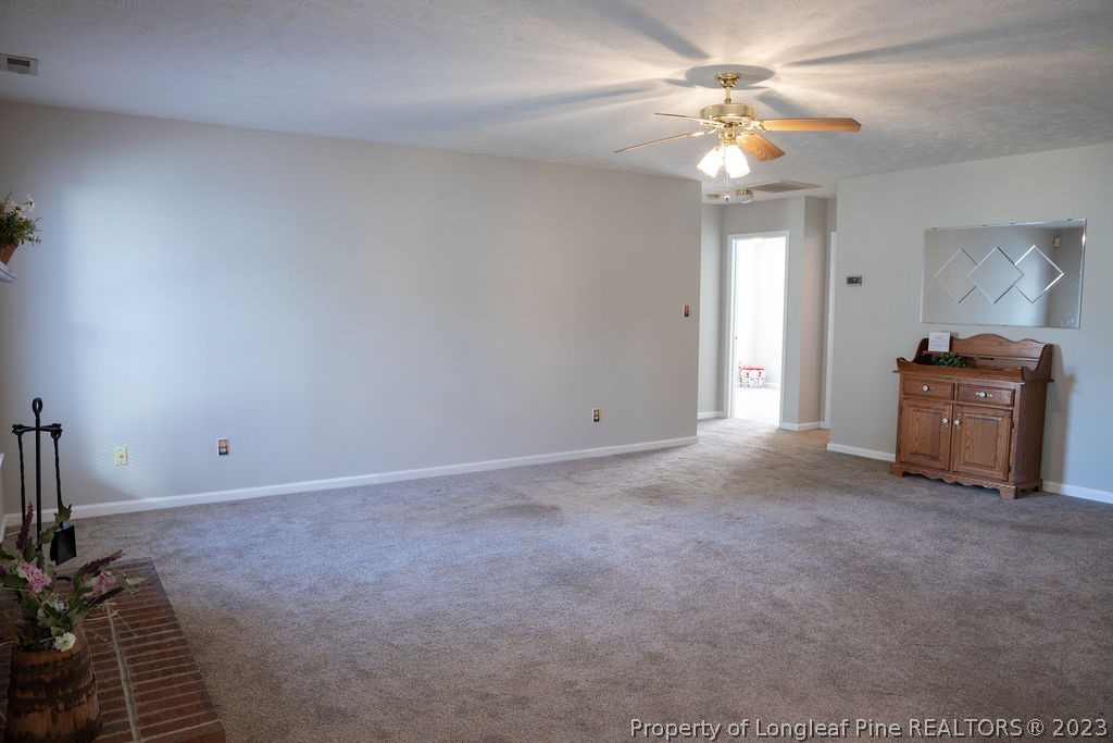 5804 Bibar Road Fayetteville, NC 28304 - Photo 5 of 37 a view of a livingroom with a ceiling fan and window